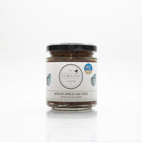 In front of a white background sits a spiced apple chutney made with st ives cider.