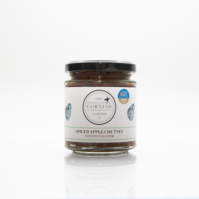 In front of a white background sits a spiced apple chutney made with st ives cider.
